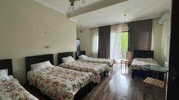 Family Room, Balcony | Individually furnished, soundproofing, iron/ironing board, free WiFi