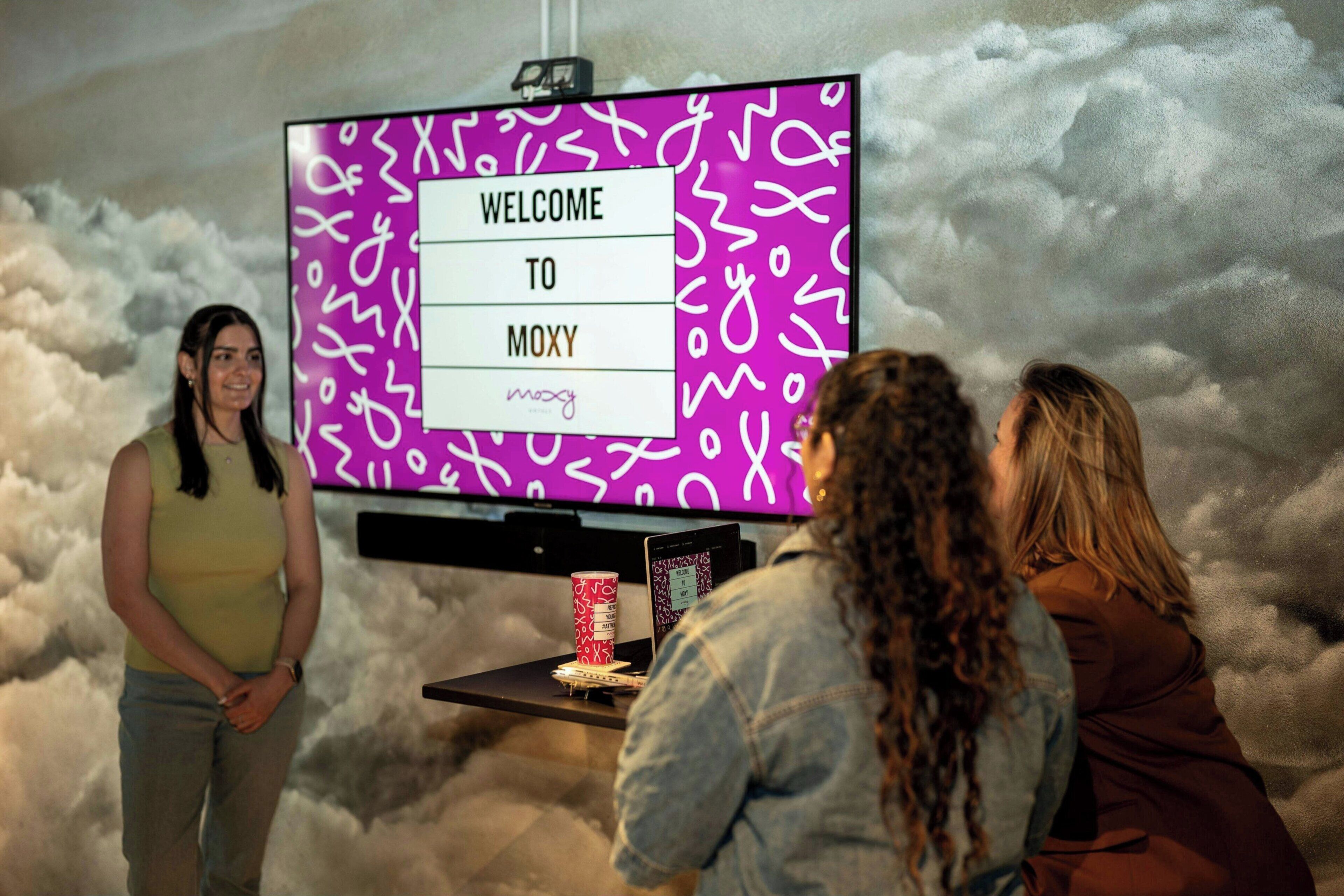 A welcome screen with a stylized background and a person standing in front of it.
