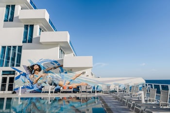 Pool amenities at Hotel Maren Fort Lauderdale Beach, Curio Collection by Hilton