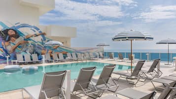 Outdoor pool, pool umbrellas, sun loungers