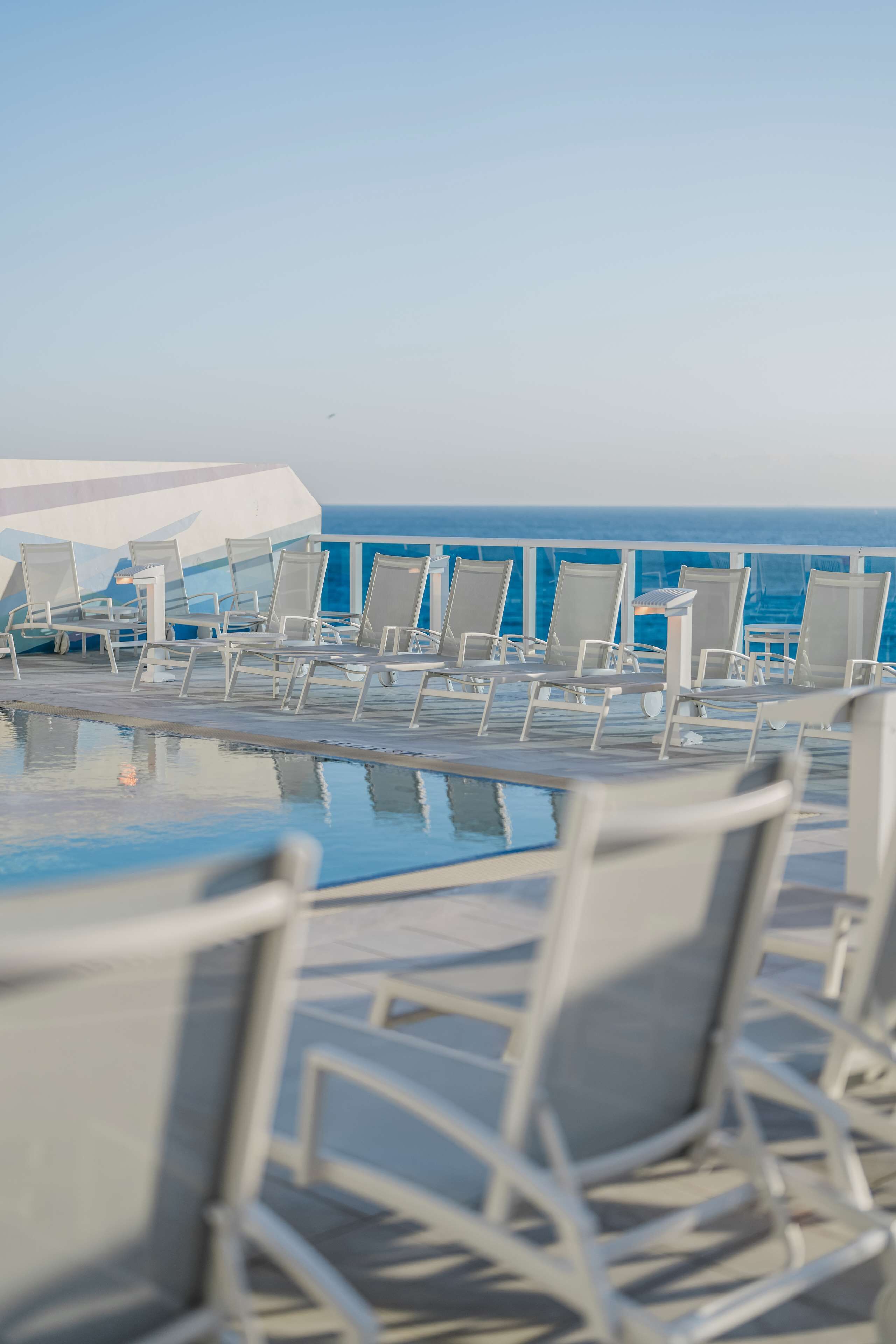 outdoor pool, pool umbrellas, pool loungers