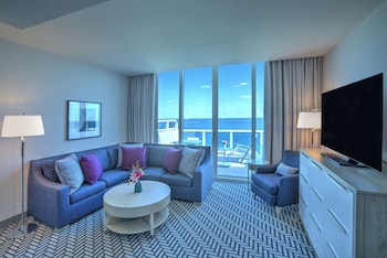 Suite, 1 King Bed (Maren) | Living area | 55-inch flat-screen TV with digital channels, TV, iPod dock at Hotel Maren Fort Lauderdale Beach, Curio Collection by Hilton