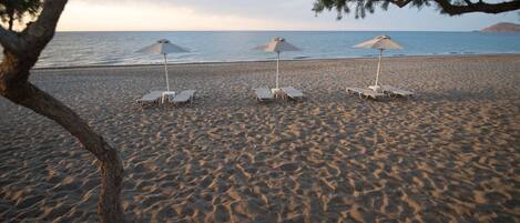 On the beach, sun-loungers, beach umbrellas