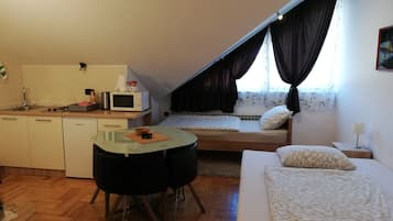 Family Studio | Living area | Flat-screen TV