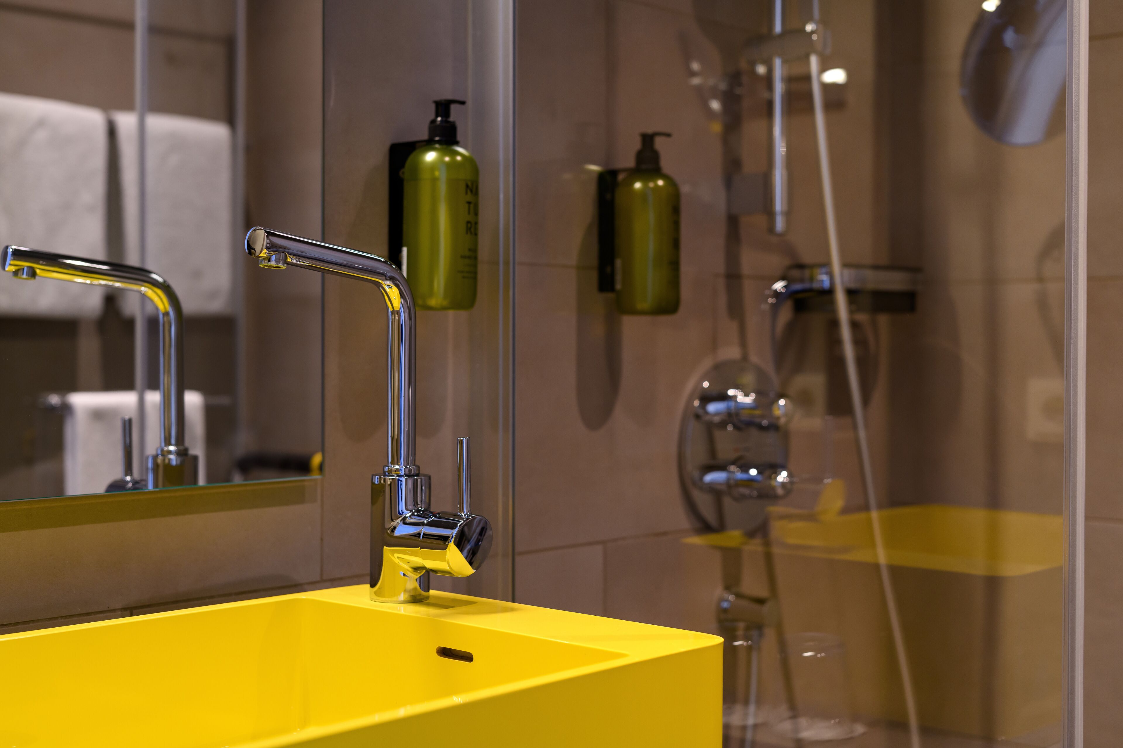 shower, rainfall showerhead, hair dryer, towels