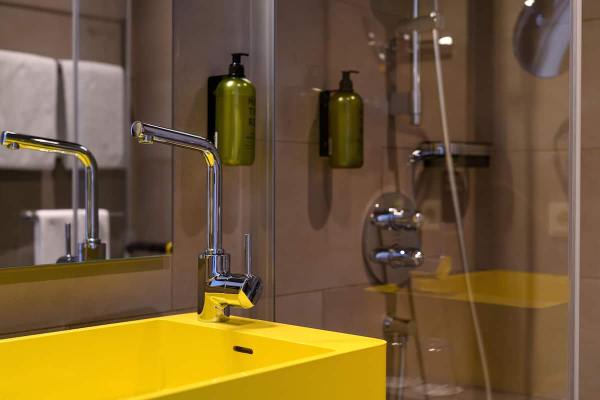 shower, rainfall showerhead, hair dryer, towels