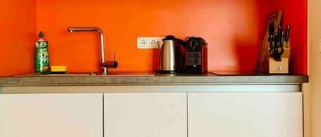 Dishwasher, coffee/tea maker, cookware/dishes/utensils