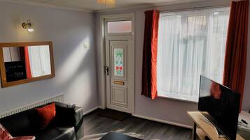 Standard House | Living area | 50-inch Smart TV with digital channels, TV, Netflix