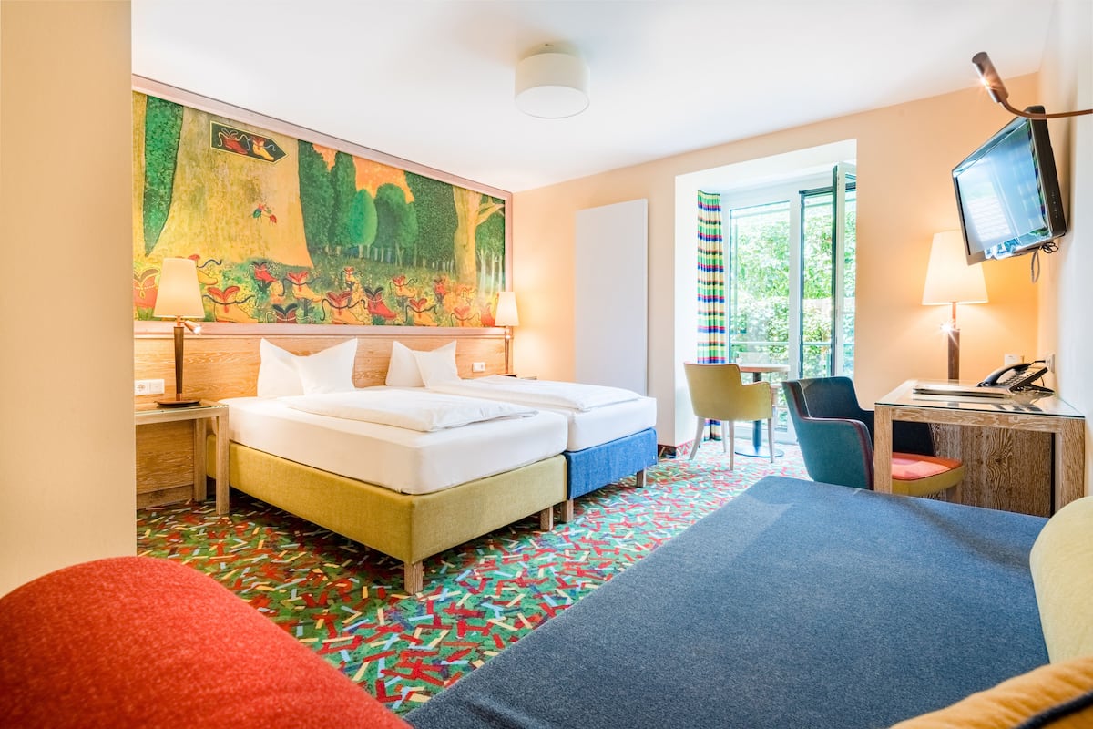 Deluxe Double Room | Living area | Flat-screen TV