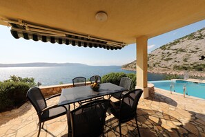 Outdoor dining - Villa with pool and private waterfront (Jablanac)