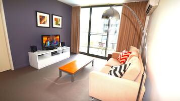 Apartment, 1 Bedroom | Living room | Flat-screen TV, DVD player