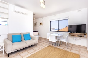 Apartment, 2 Bedrooms | Living area | Flat-screen TV, DVD player