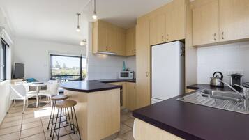 Apartment, 2 Bedrooms | Private kitchen | Full-size fridge, microwave, oven, stovetop