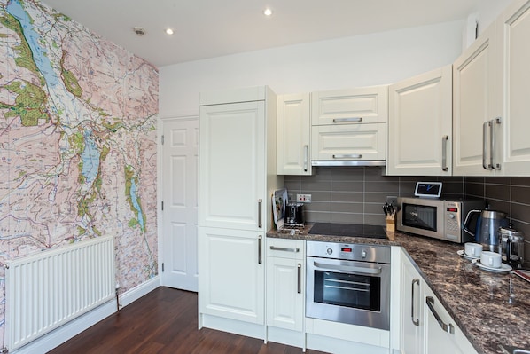 Comfort Apartment | Private kitchen | Full-sized fridge, microwave, oven, stovetop