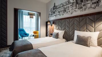 Habitación Deluxe con 1 cama doble o 2 individuales | Minibar, caja fuerte, escritorio y cortinas opacas