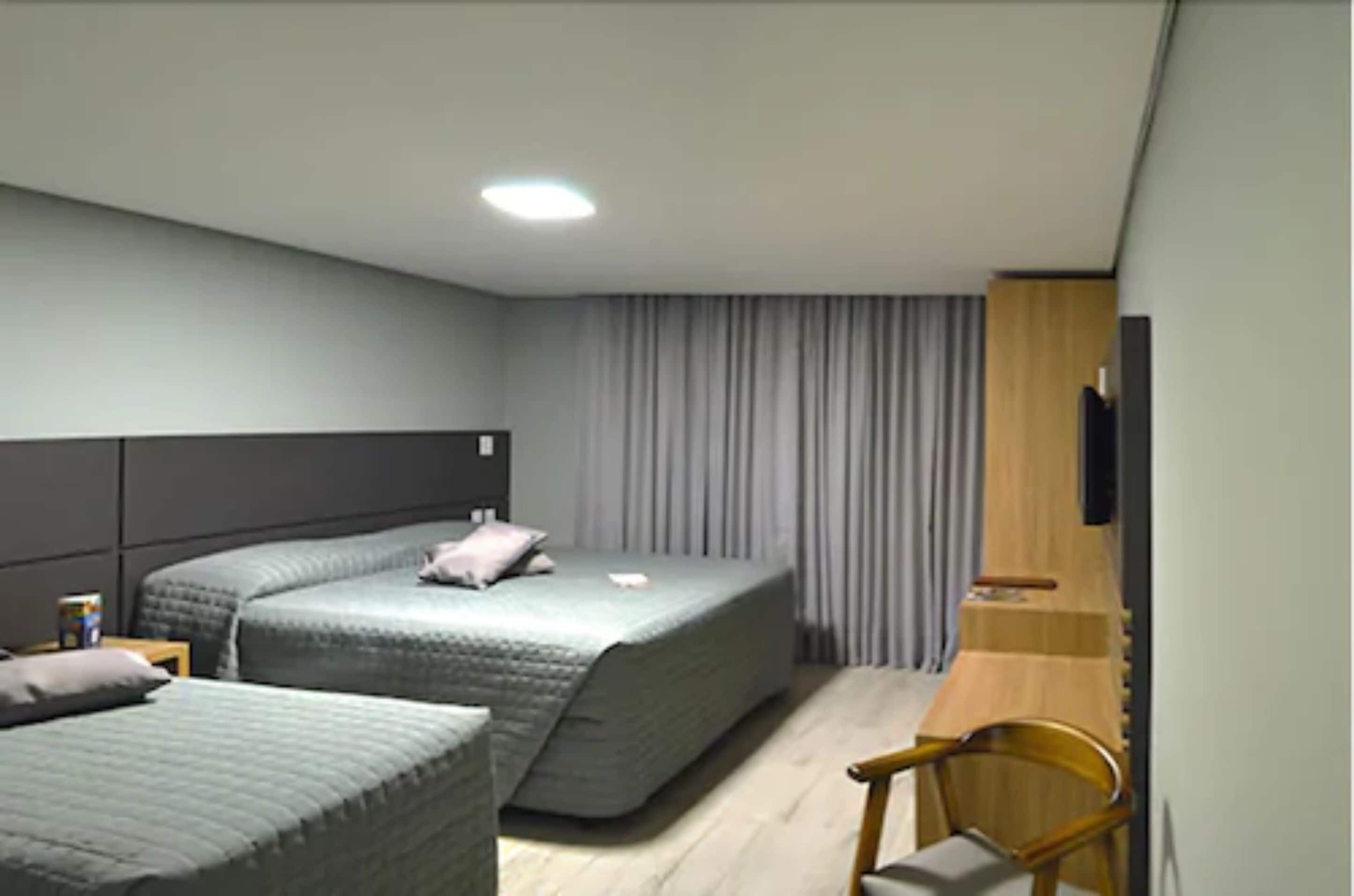 deluxe triple room | 1 bedroom, minibar, desk, blackout curtains