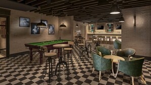 A billiards table, multiple bar stools, and a bar area with shelves and bottles. - Lemon Tree Premier New Town Kolkata (Barasat)