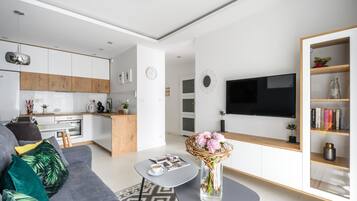 Deluxe Apartment | Living room | 50-inch LCD TV with cable channels, TV
