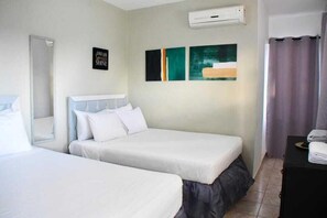 Family Double Room, 2 Queen Beds, Balcony, Bay View | Premium bedding, blackout drapes, soundproofing, free WiFi - Casa Docia Samana (Samaná)