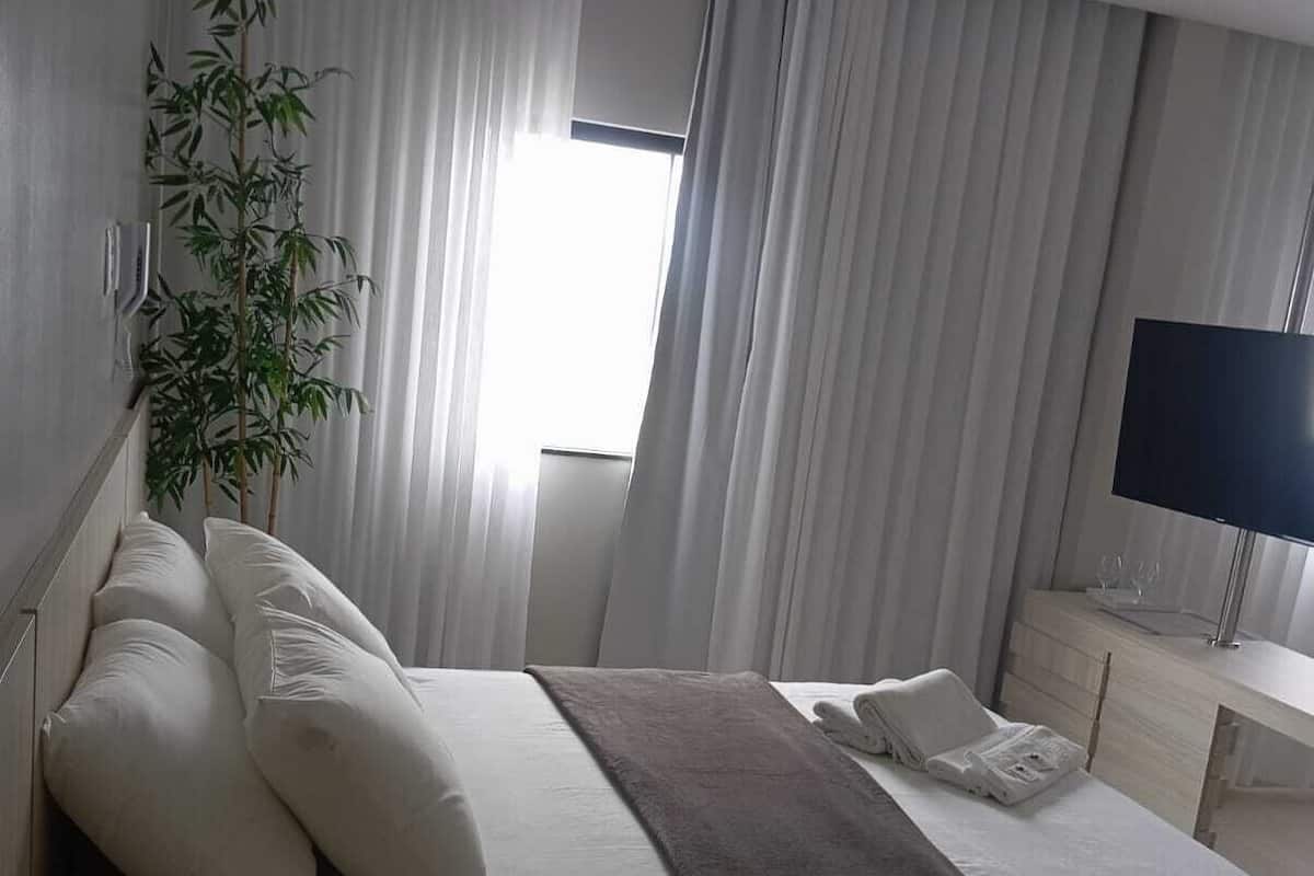 Suite Deluxe | Minibar, ropa de cama, accesible en silla de ruedas