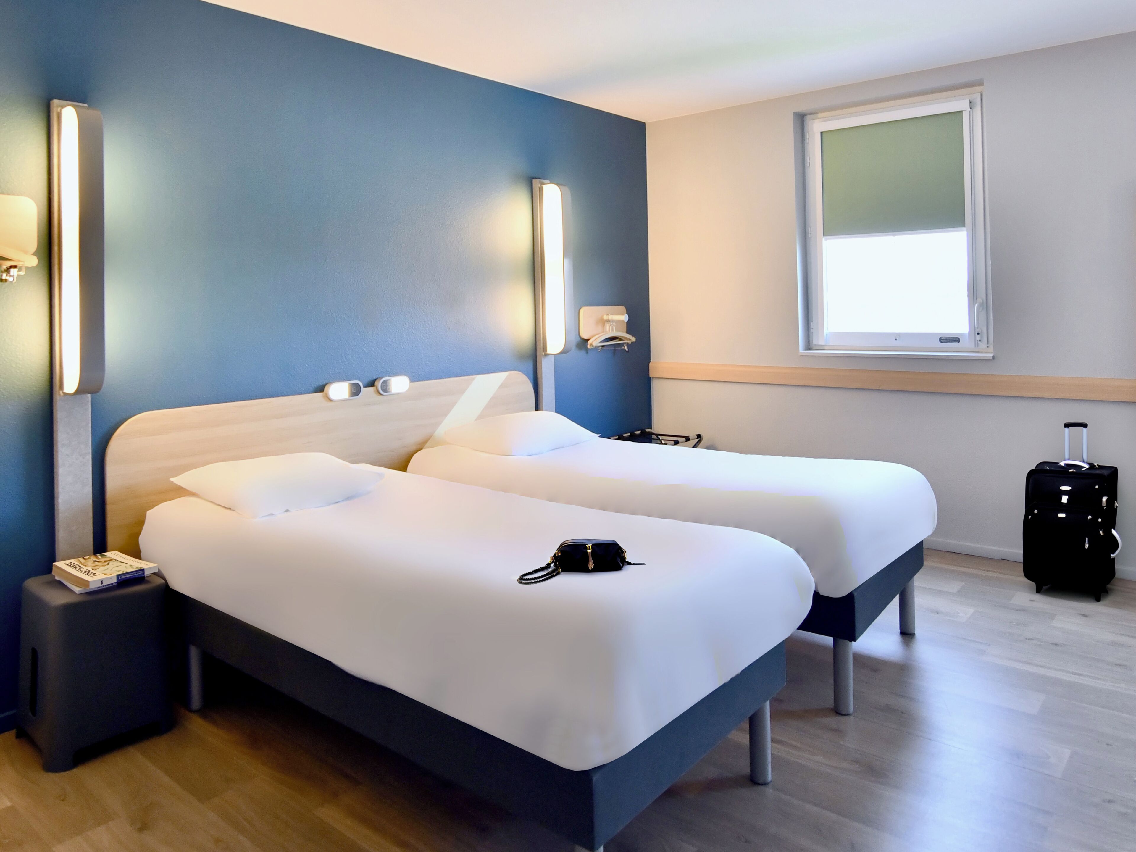 Premium bedding, desk, laptop workspace, soundproofing