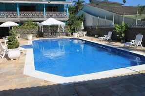 Outdoor pool, free pool cabanas, pool umbrellas