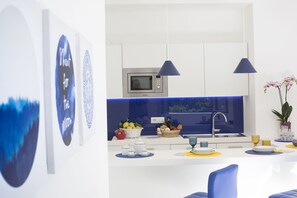 Apartment, 2 Bedrooms | Private kitchen | Full-size fridge, microwave, stovetop, dishwasher