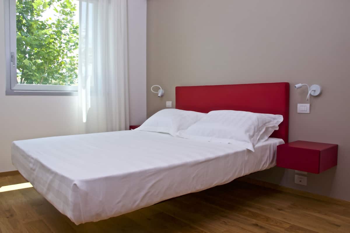 Quadruple Room | Minibar, in-room safe, desk, blackout curtains