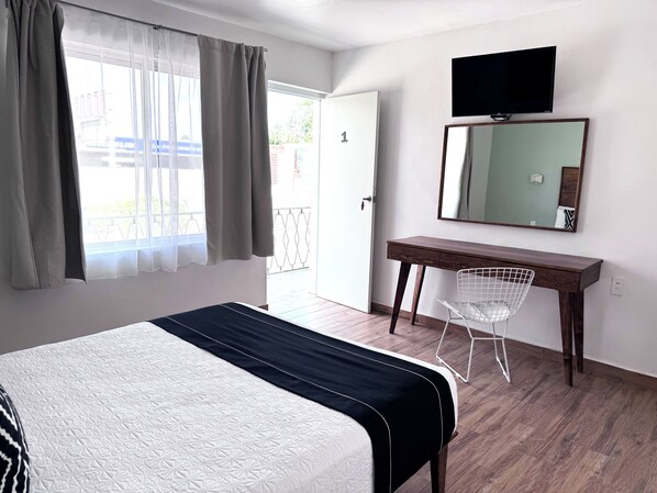 Habitación Deluxe | Insonorización, tabla de planchar con plancha y wifi gratis 