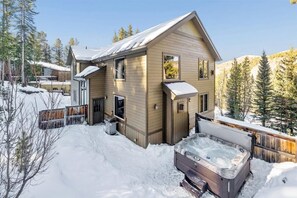A wooden cabin with a hot tub in a snowy outdoor area. - High Point Lodge-Spacious Breck Ski Home, Multiple Fireplaces, Gondola 2.1mi, Sleeps 10 (Breckenridge)