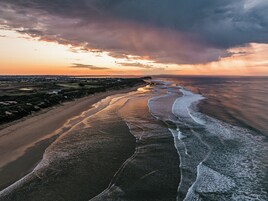 Beach nearby, white sand, beach towels
