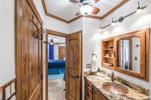 A bathroom with a wooden vanity, a sink, and a mirror. - Sea Gull #304: Beachfront 2 Bedroom 2 Bathroom With Spectacular Views and 24 Hour Management (Port Aransas)