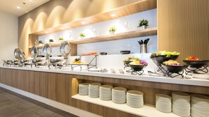 A buffet setup with various dishes and utensils. - Madison Bangkok (Bangkok)