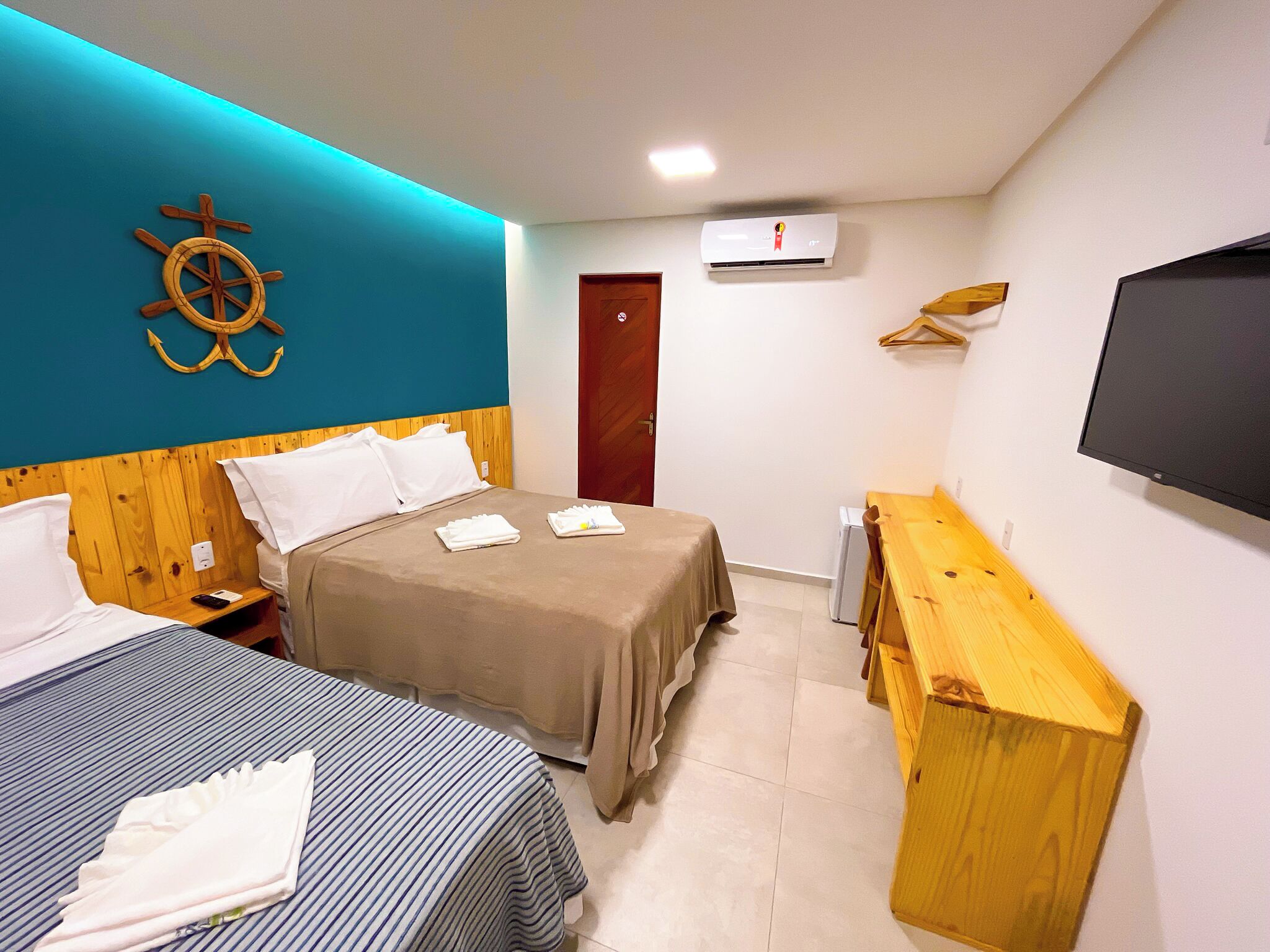 Standard Triple Room | Minibar, desk, laptop workspace, individually decorated