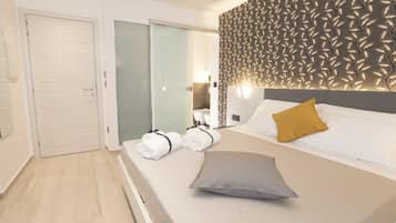 Premium bedding, down comforters, memory foam beds, minibar
