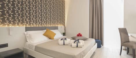 Premium bedding, down comforters, memory foam beds, minibar