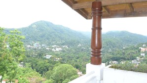 A view of a mountainous landscape with a wooden structure in the foreground. - Primrose Bungalow (Kandy)