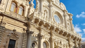 A grand historical building with ornate architectural details, including columns, statues, and decorative elements. - BnB 95mo (Lecce)