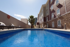 Outdoor pool, pool umbrellas, sun loungers