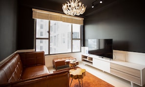 Deluxe Apartment, 3 Bedrooms | Living area | LED TV - Asian Dream Home - The Tresor (Ho Chi Minh City)