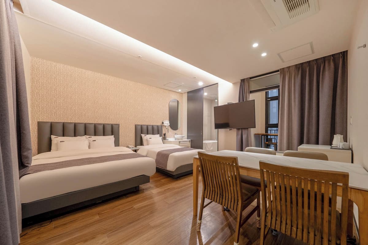 Family Suite | Minibar (free items), desk, laptop workspace, blackout drapes