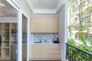Fridge, microwave, cookware/dishes/utensils, paper towels