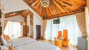 A hotel room with two beds, a TV, a desk, and a chair. - Mac Valley Dalat Hotel (Xuan Huong - Da Lat)