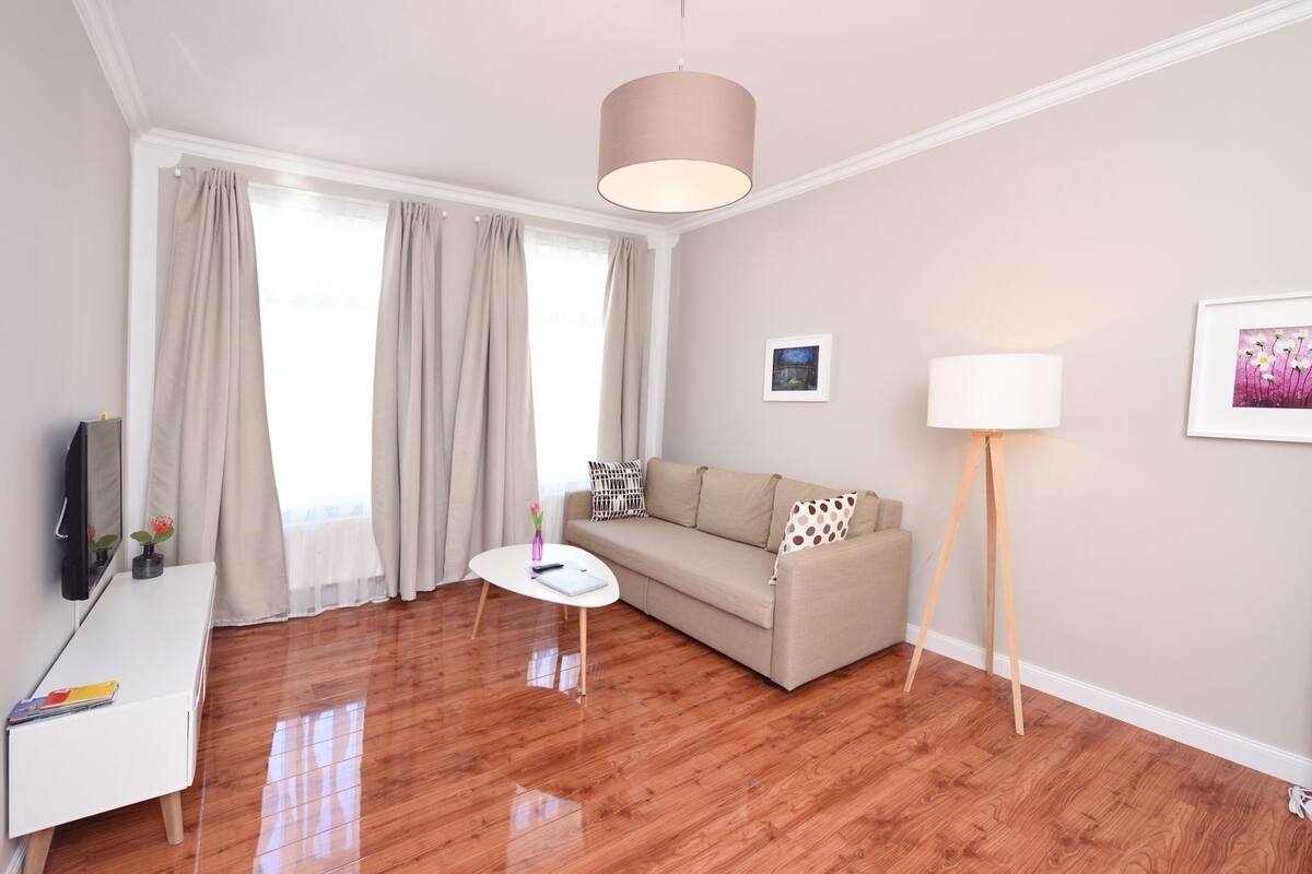 City Apartment, Sauna | Living area | 44-inch Smart TV with cable channels, TV