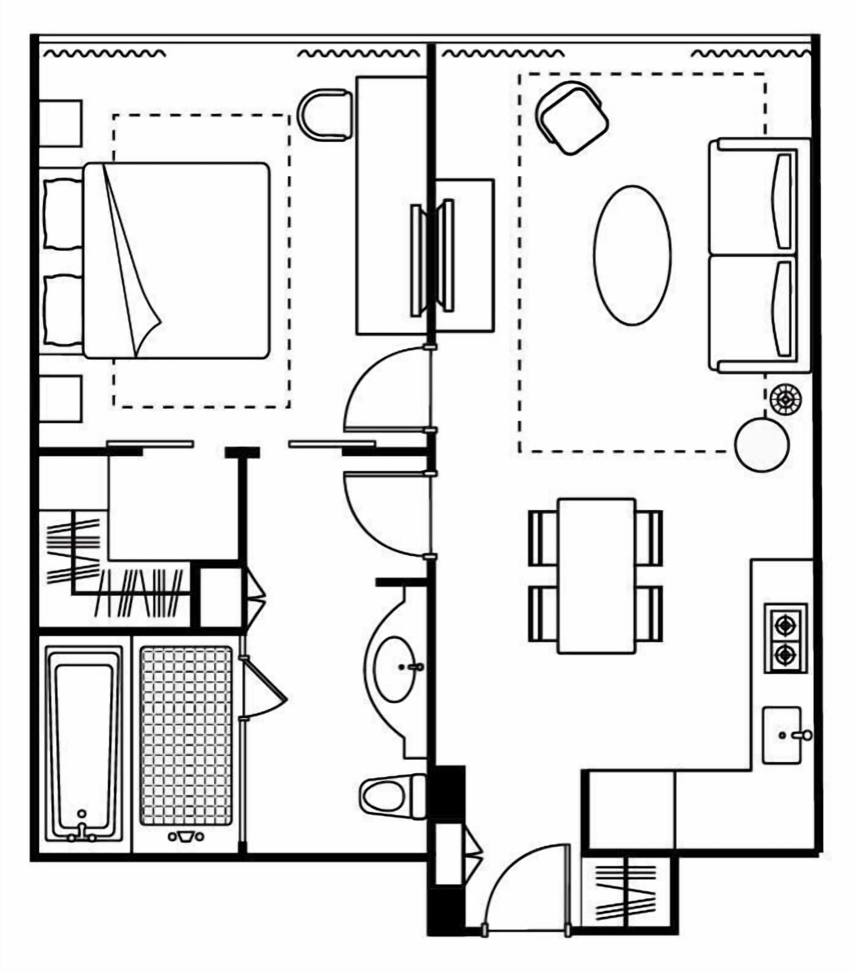 A floor plan of a hotel room with a bed, a bathroom, a kitchenette, and a dining area.