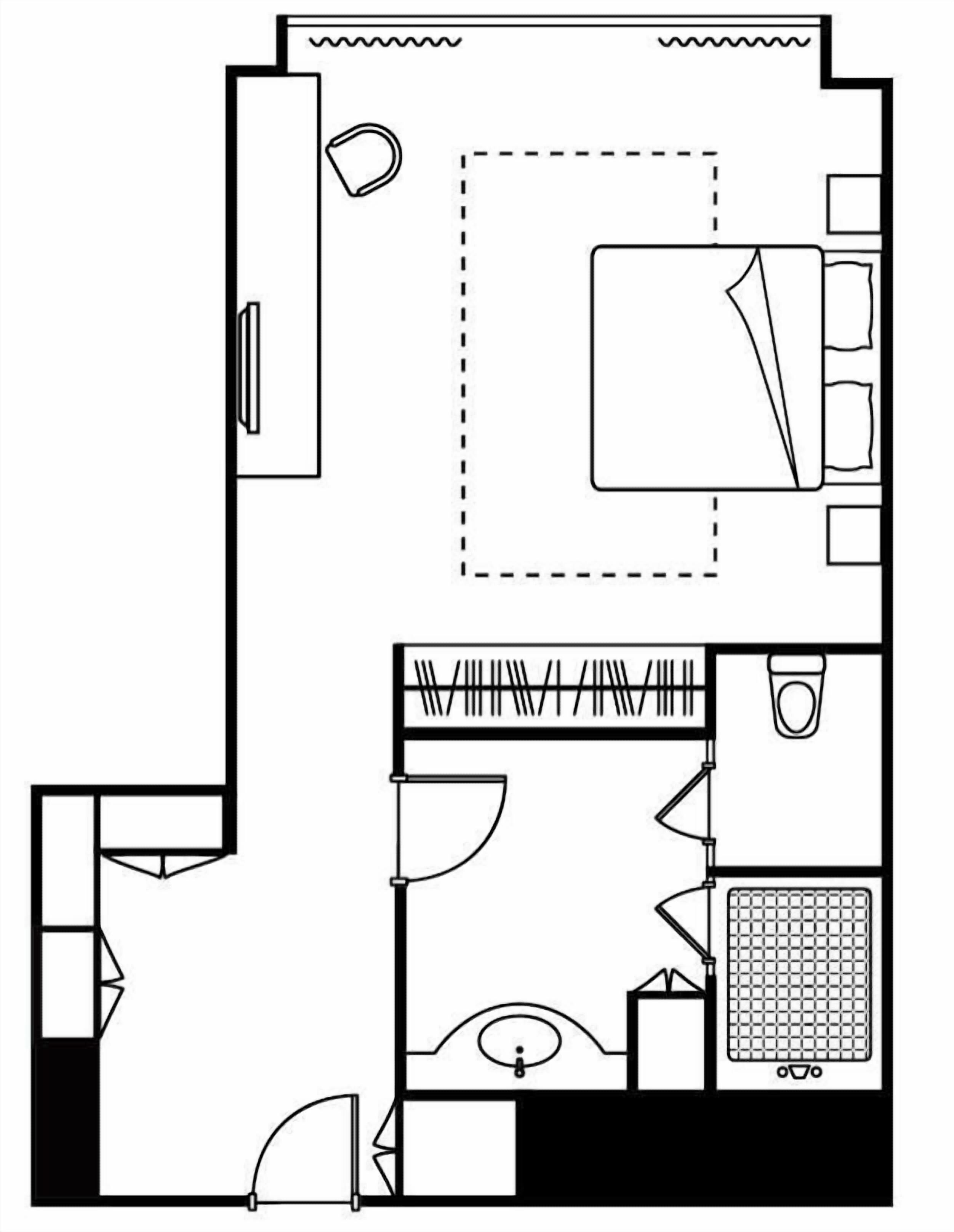 Ein Grundriss mit Küche, Essbereich und einem separaten Schlafzimmer mit Bad.