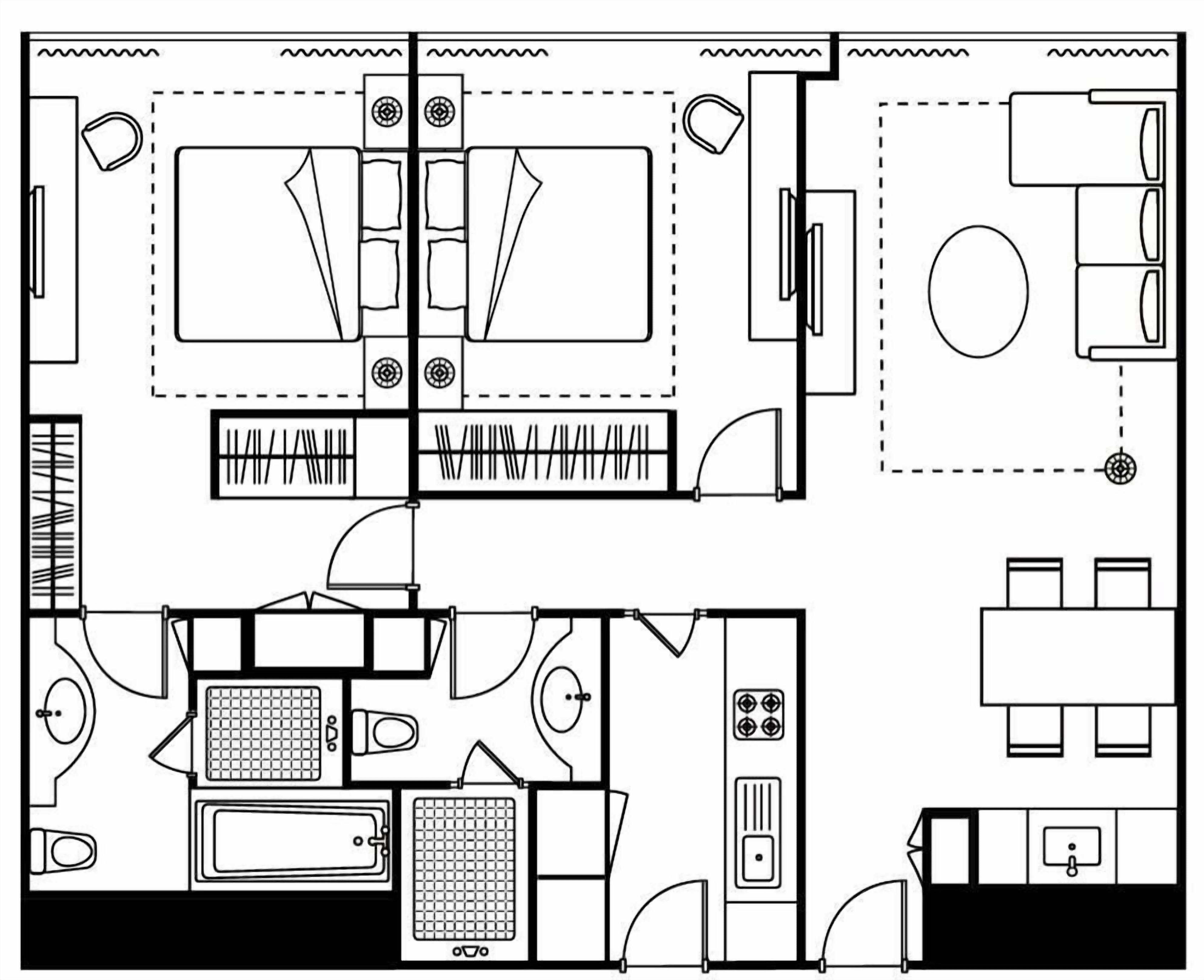 A hotel layout with a dining area, kitchen, and separate bathroom.