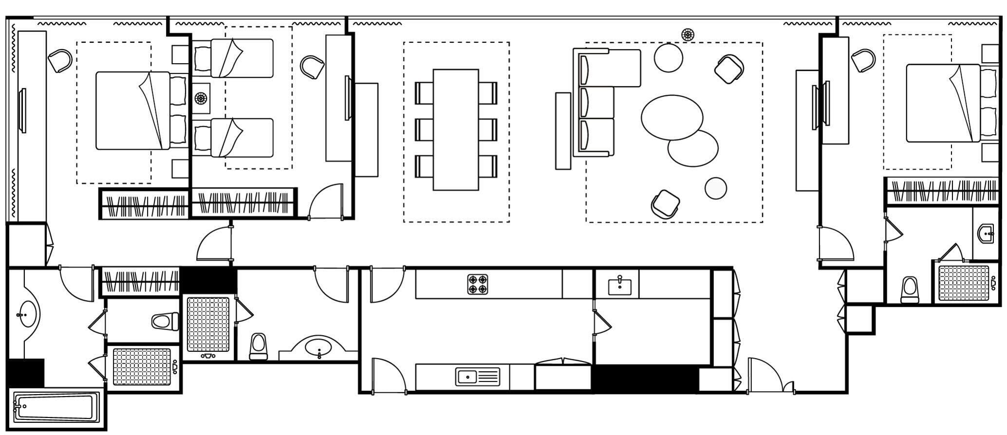 A hotel layout with multiple rooms, a central dining area, and a kitchen.