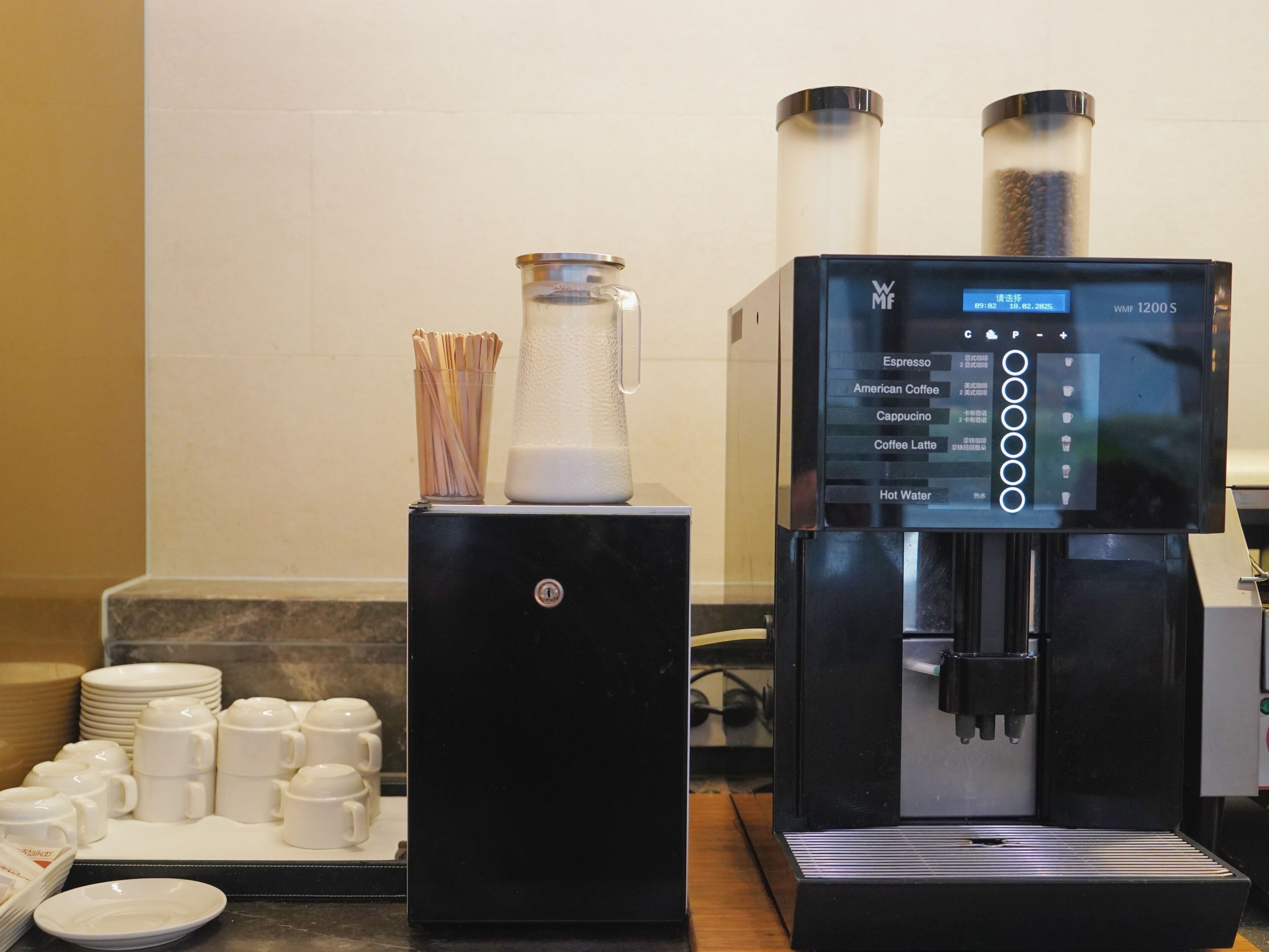 A coffee machine with a digital display and a coffee grinder.