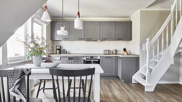 Deluxe Suite Ljuva Natt with balcony | Private kitchen | Full-size fridge, oven, stovetop, dishwasher